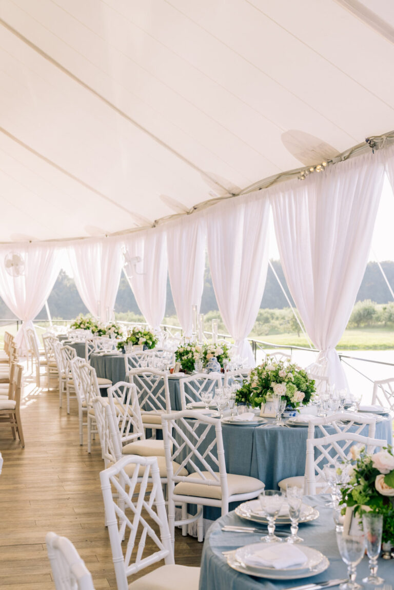 Tented wedding design reception with white draping and floral centerpieces planning Rishi Patel