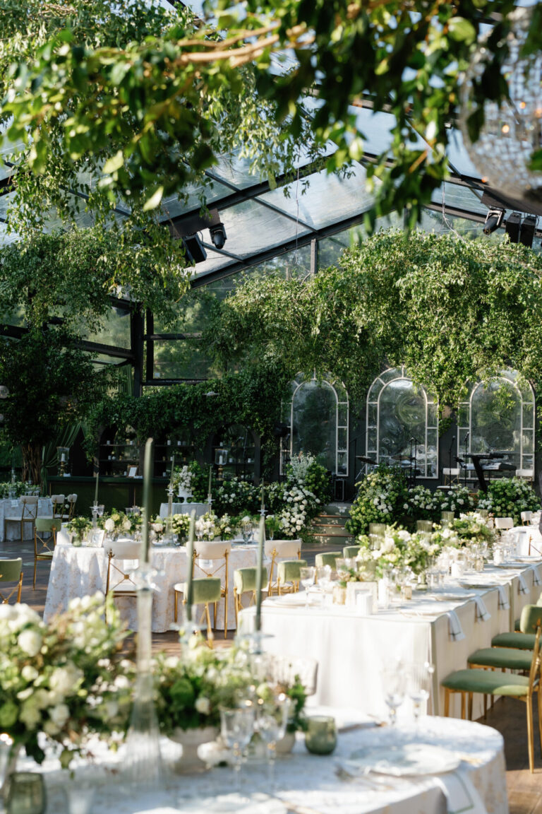 Midwest garden wedding design reception with long white tables, floral arrangements and greenhouse structure wedding production Rishi Patel