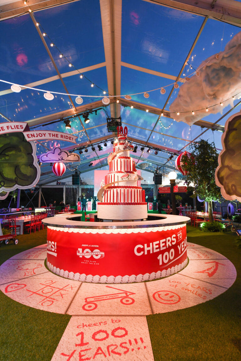 Corporate event designer Rishi Patel created a “Cheers to 100 Years” anniversary display for HMR Designs