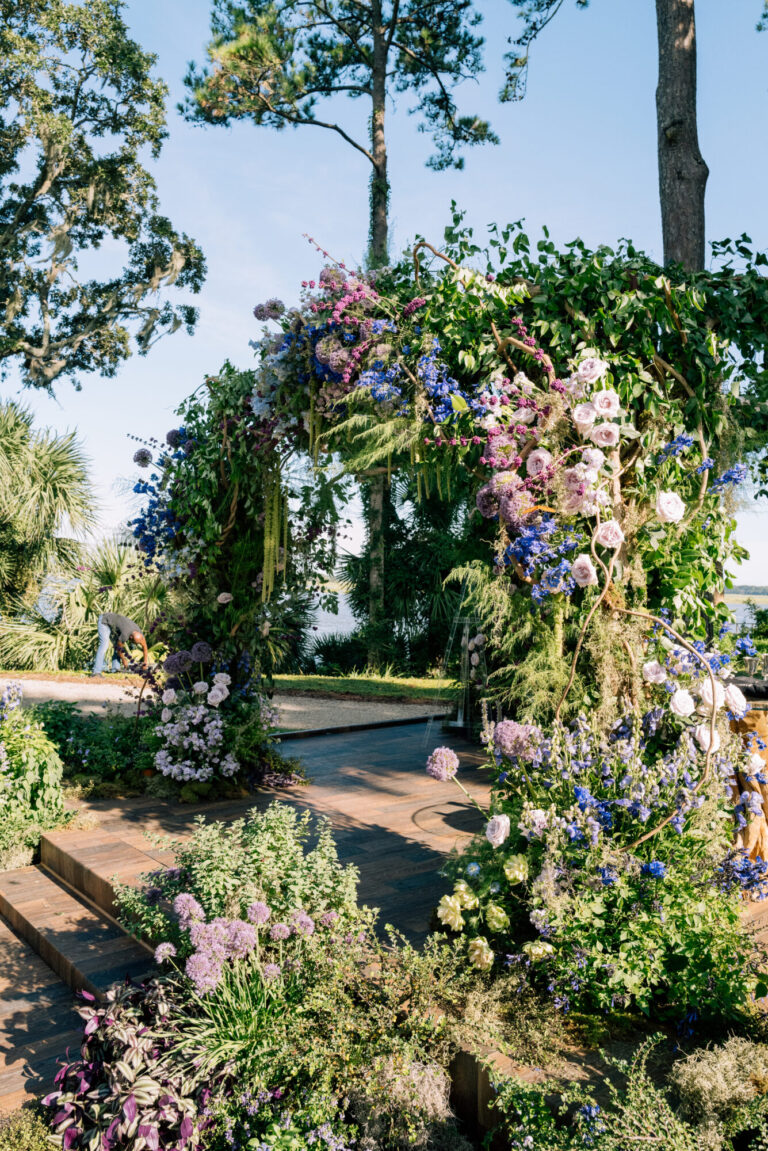 Destination wedding event design garden ceremony with purple, pink and white floral arrangements planning Rishi the Designer