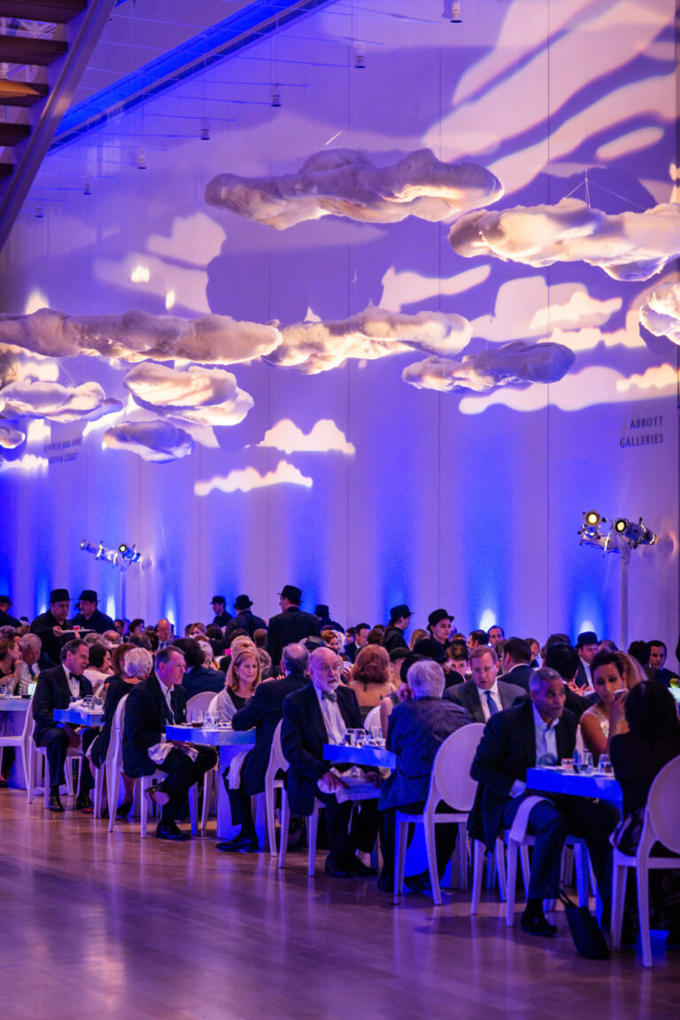 Art Institute of Chicago corporate event design featuring a formal dinner beneath illuminated hanging clouds by HMR Designs