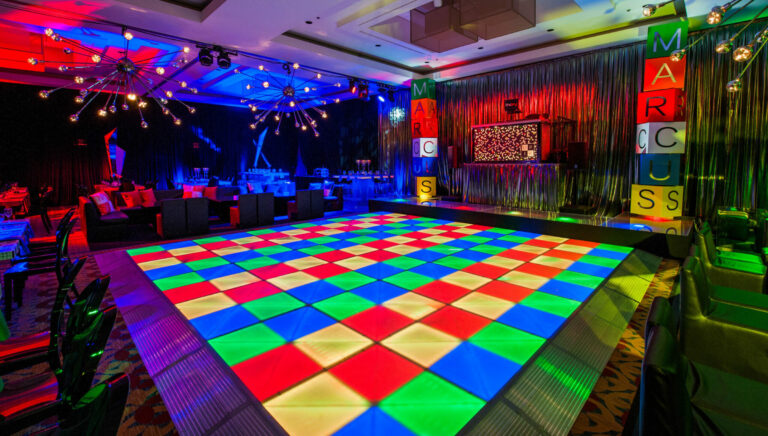 Chicago bat mitzvah design featuring a colorful illuminated dance floor and vibrant club-inspired lighting by event design and production company HMR Designs