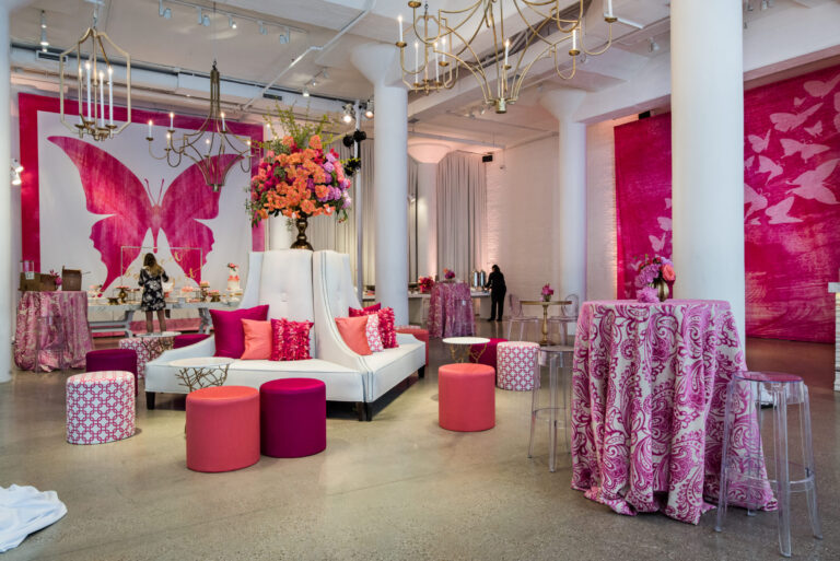 Chicago bat mitzvah design featuring pink lounge furniture, custom graphics and vibrant floral arrangements by event design company HMR Designs
