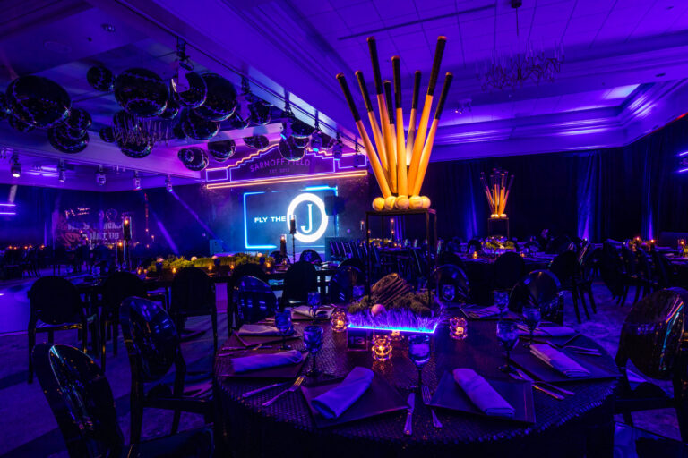 Chicago bar mitzvah design featuring a neon monogram, vibrant lighting and custom lounge seating by event design and production company HMR Designs