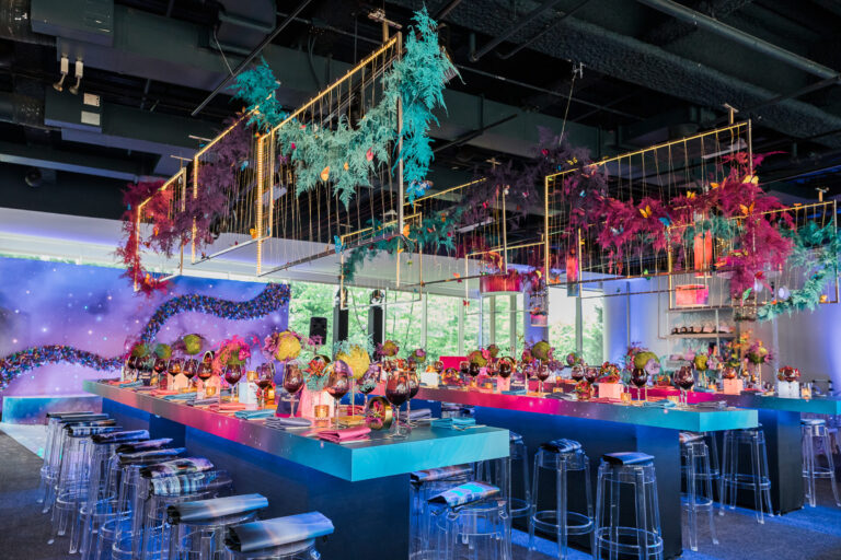 Chicago bat mitzvah design featuring colorful lounge seating, suspended florals and playful tropical décor by event design and production company HMR Designs