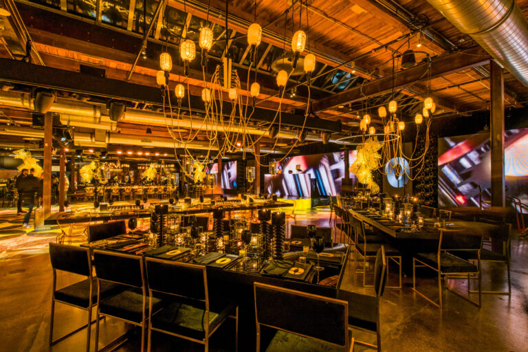 Chicago bar mitzvah design featuring dramatic amber lighting, custom bars and industrial décor by event design and production company HMR Designs
