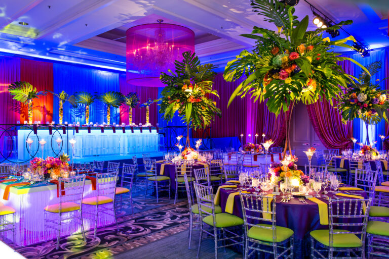 Chicago suburbs bat mitzvah design featuring tropical florals, vibrant draping and colorful lounge furniture by HMR Designs
