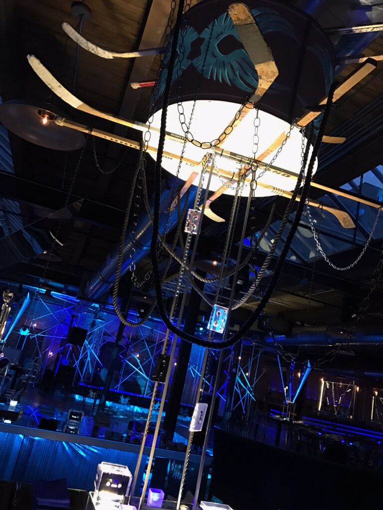 Chicago bar mitzvah design featuring sculptural suspended ribbons and dramatic blue lighting by HMR Designs